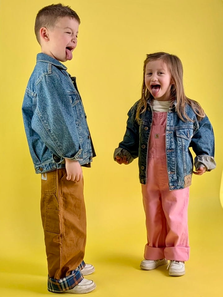 2 kids dressed in vintage clothes