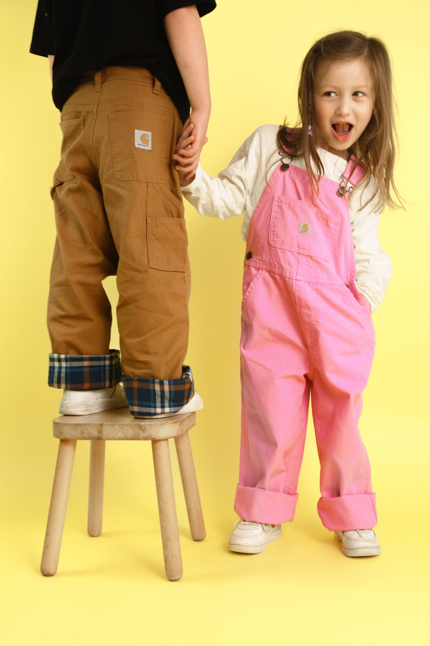 Children dressed in vintage carhartt