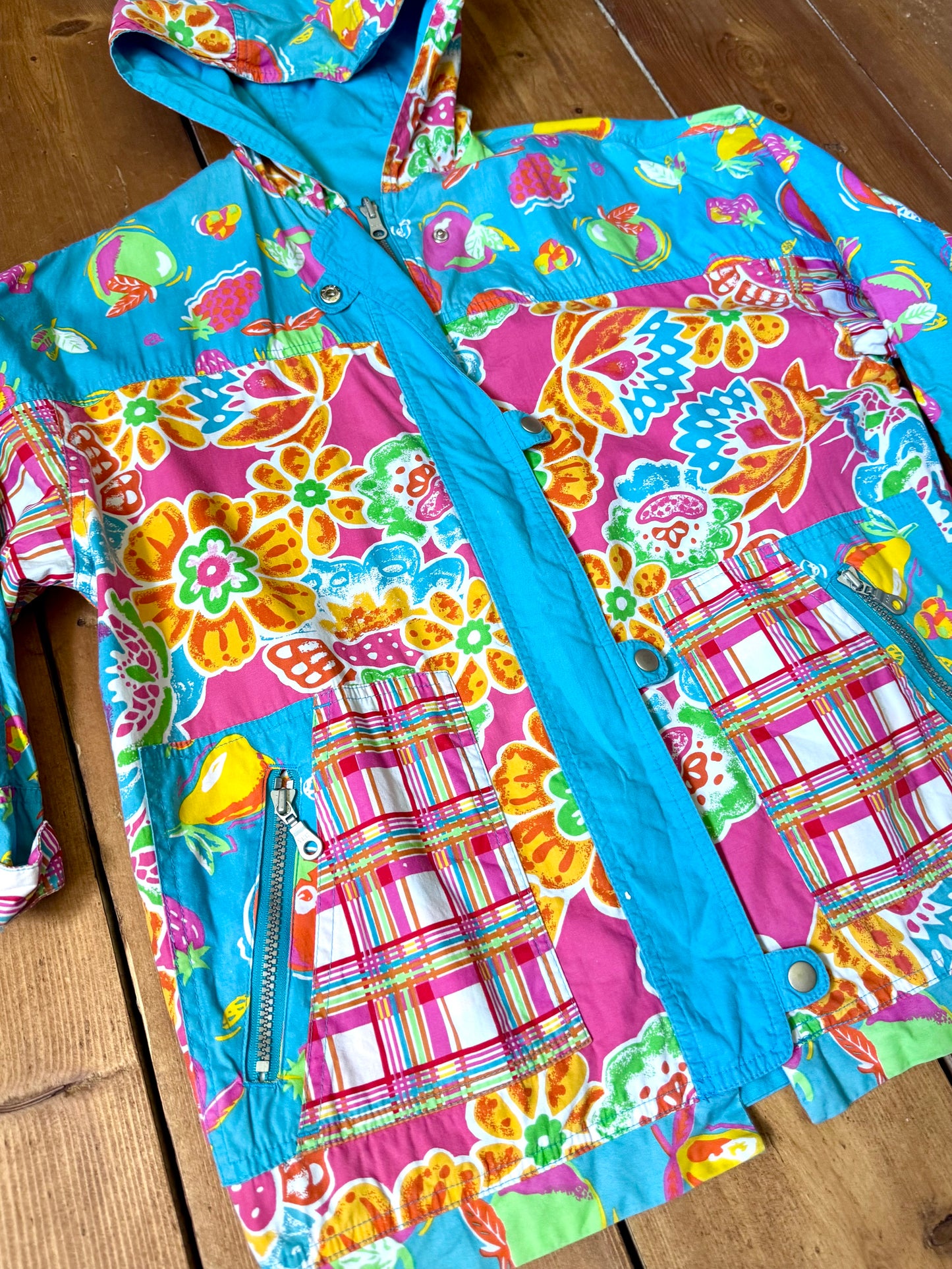 Vintage 90s reversible kids hooded jacket featuring colourful tropical floral prints and a turquoise reverse. Kids vintage lightweight summer coat. Handpicked for Bee Tiny kids vintage.