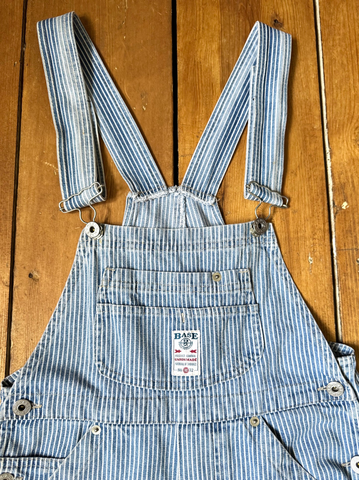 Vintage 90s hickory stripe denim short dungarees with adjustable straps. Vintage kids dungaree shorts. Handpicked for Bee Tiny kids vintage.