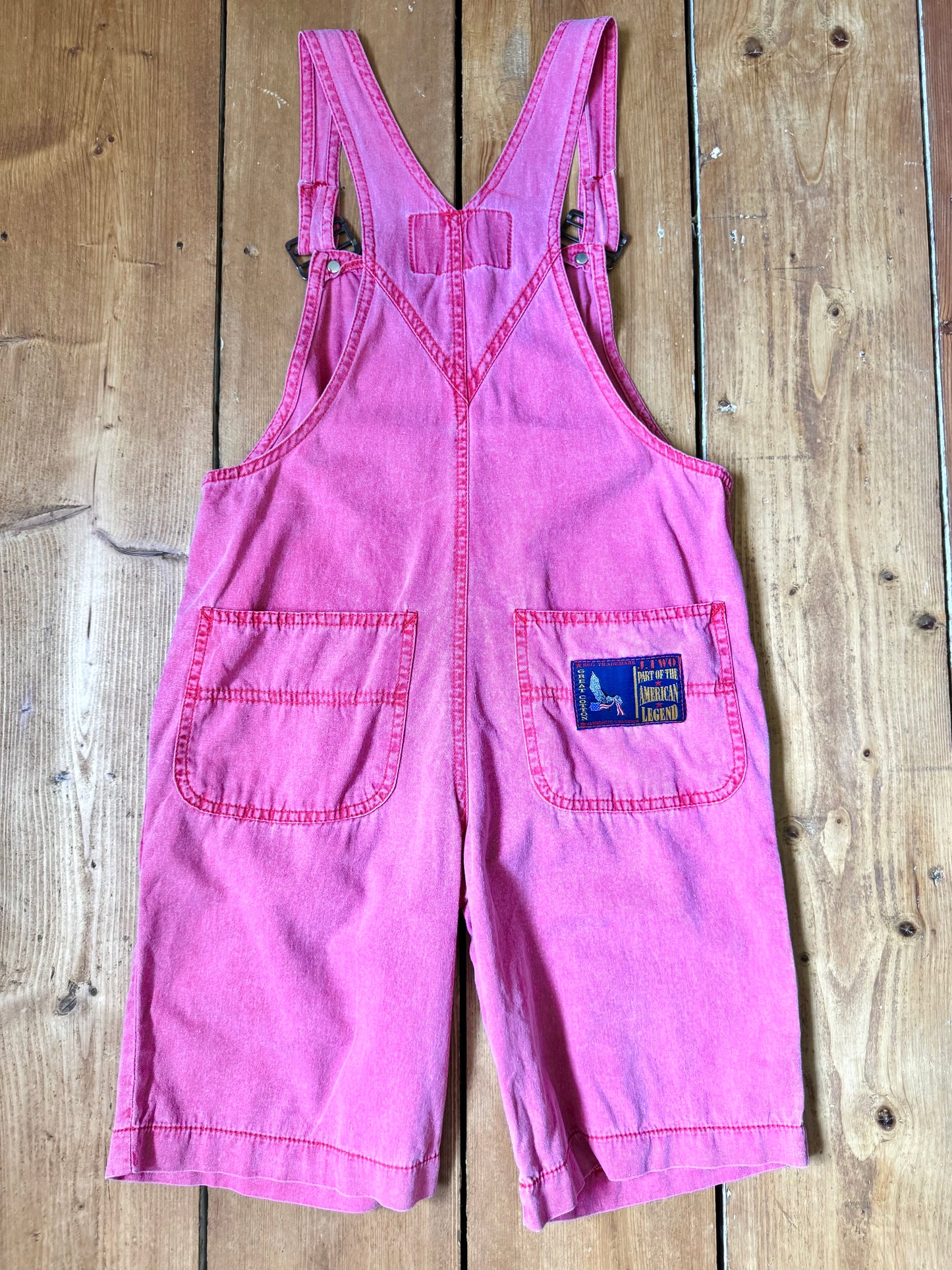 Vintage 90s pink dungaree shorts with paisley patchwork detailing. A colourful summer vintage favourite for kids. Handpicked for Bee Tiny kids vintage. 