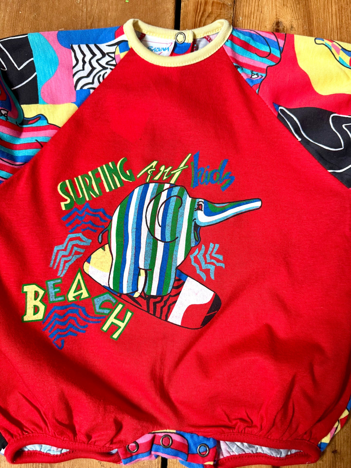 Vintage 90s colourful elephant baby romper with bold prints. Handpicked for Bee Tiny kids vintage.