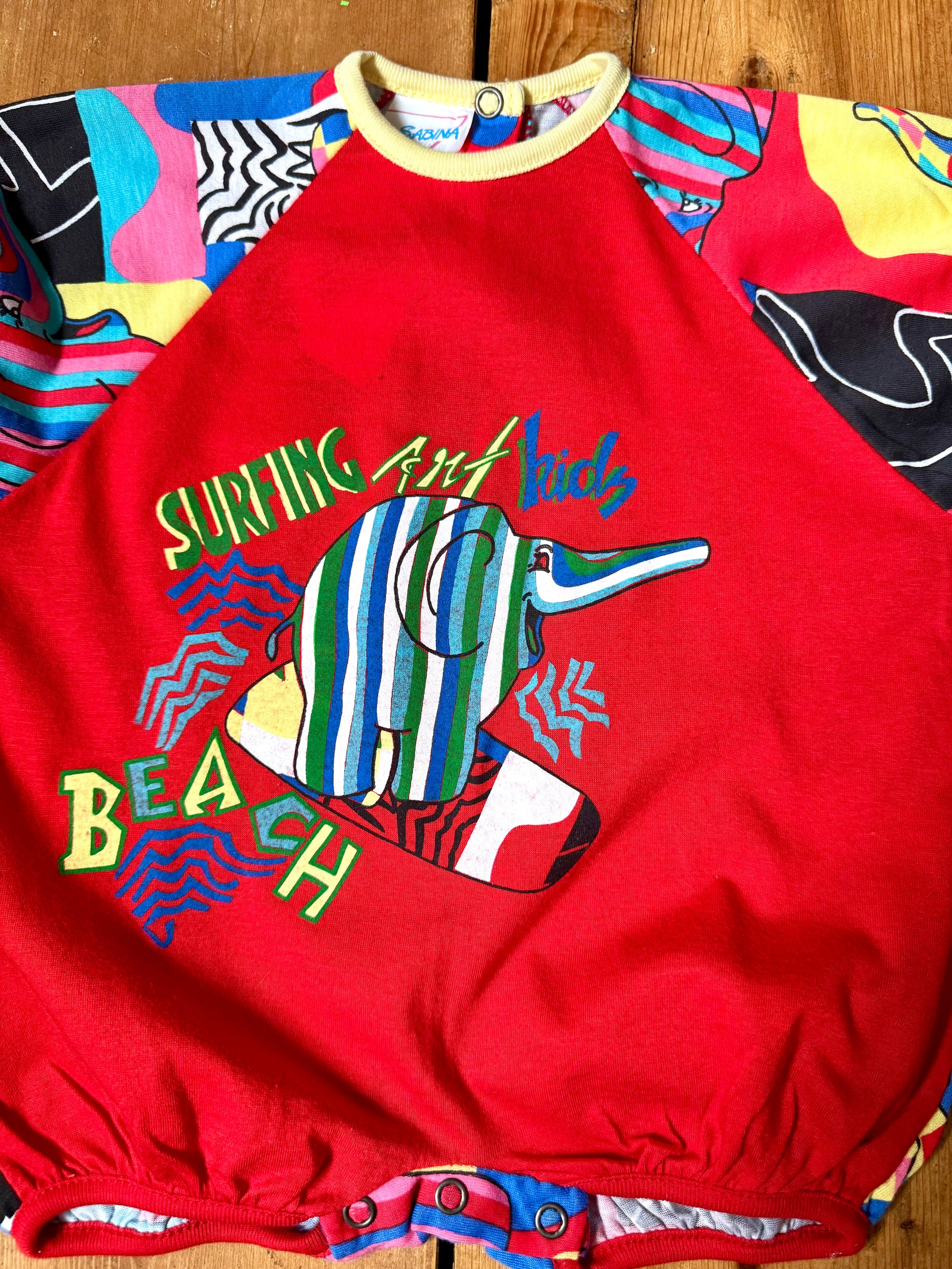 Vintage 90s colourful elephant baby romper with bold prints. Handpicked for Bee Tiny kids vintage.
