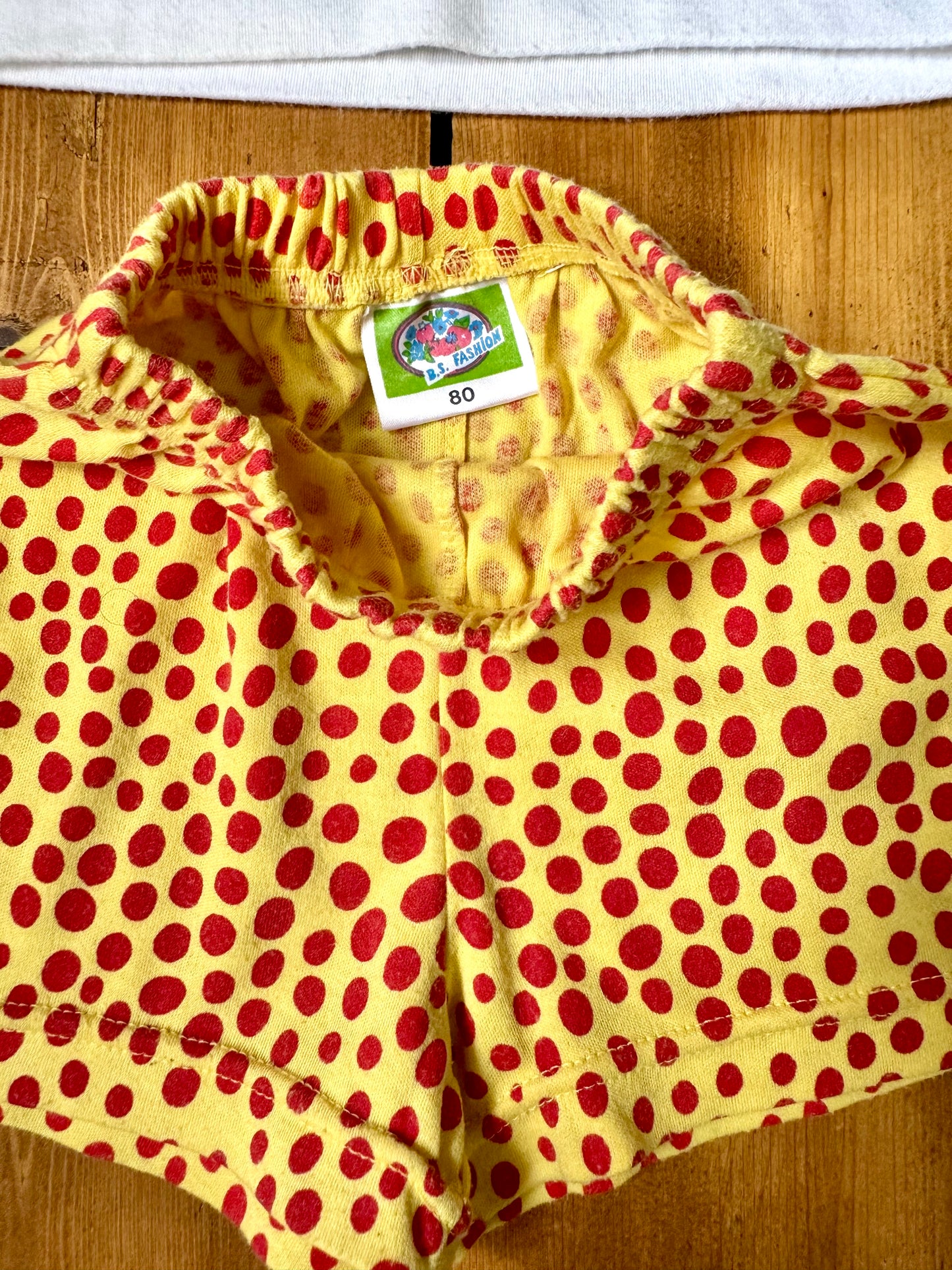 Vintage 90s embroidered Jamaica tee with yellow polka dot shorts. Authentic late 80s/early 90s children's vintage, handpicked for Bee Tiny kids vintage.