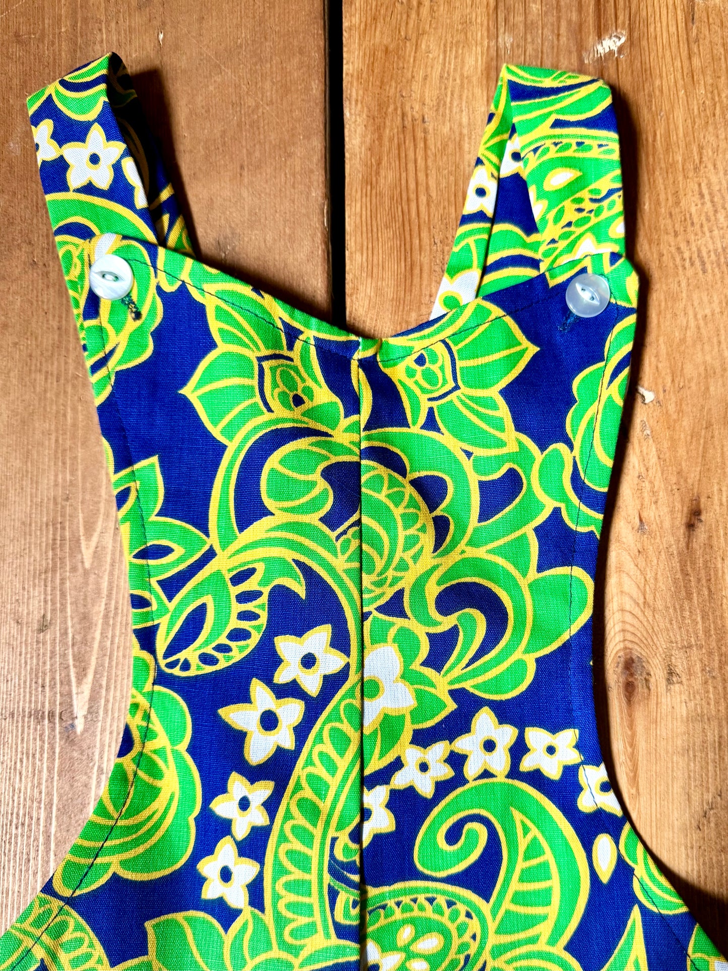 Vintage 70s green romper, dungaree shorts. Psychedelic print dungaree shorts. Handpicked for Bee Tiny kids vintage. 