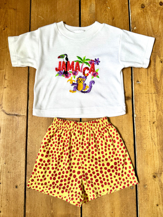 Vintage 90s embroidered Jamaica tee with yellow polka dot shorts. Authentic late 80s/early 90s children's vintage, handpicked for Bee Tiny kids vintage.