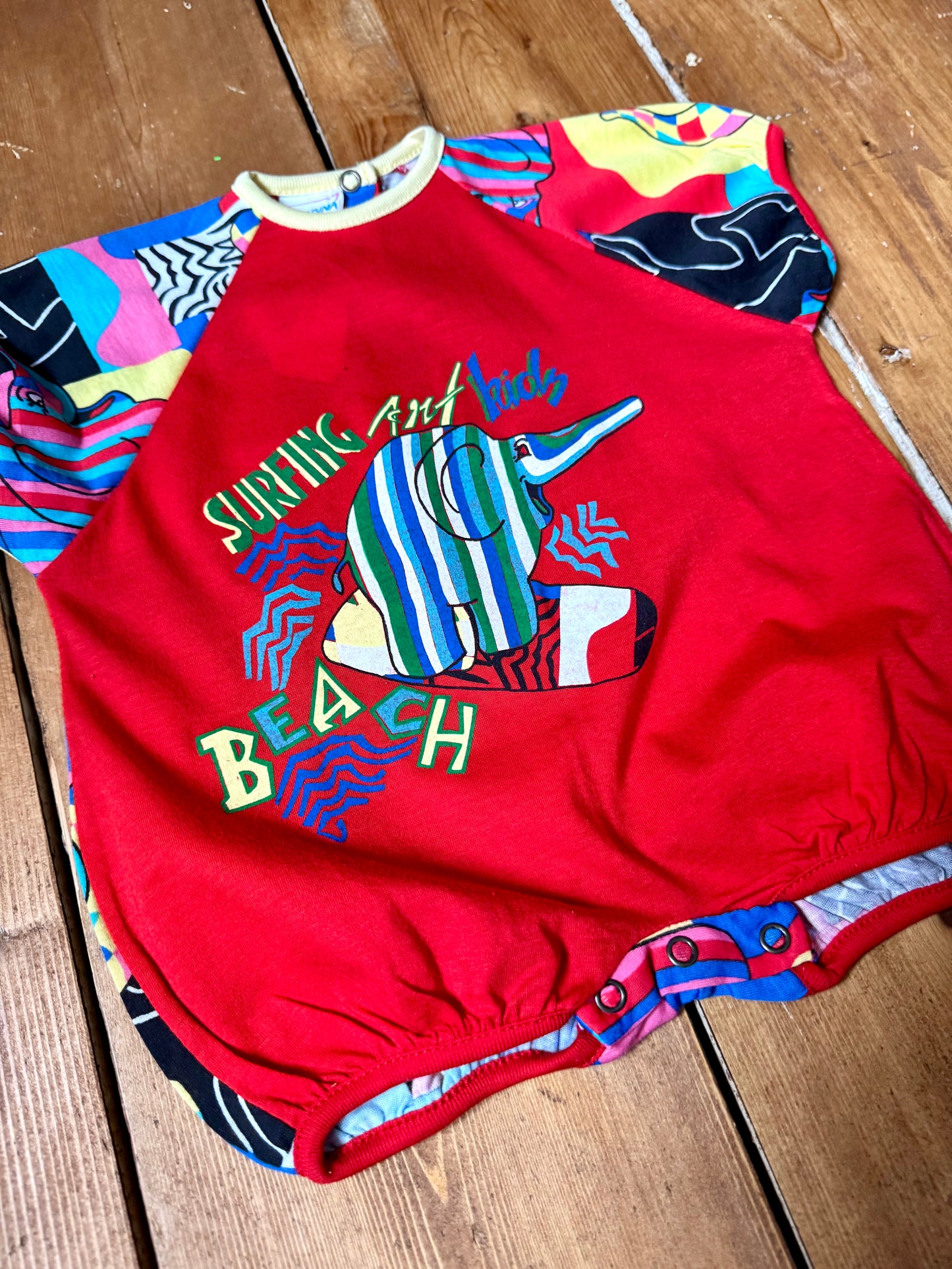 Vintage 90s colourful elephant baby romper with bold prints. Handpicked for Bee Tiny kids vintage.