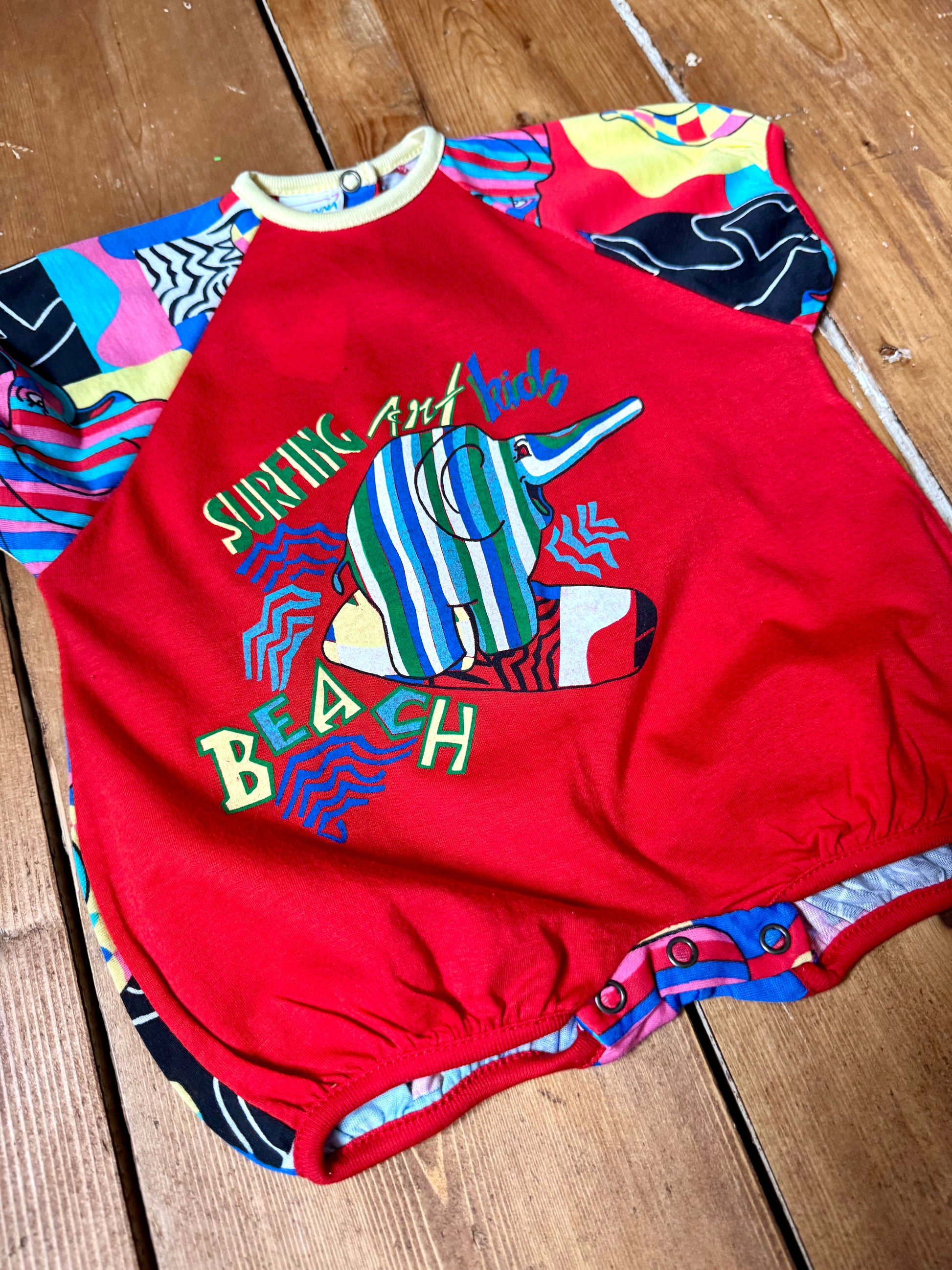 Vintage 90s colourful elephant baby romper with bold prints. Handpicked for Bee Tiny kids vintage.
