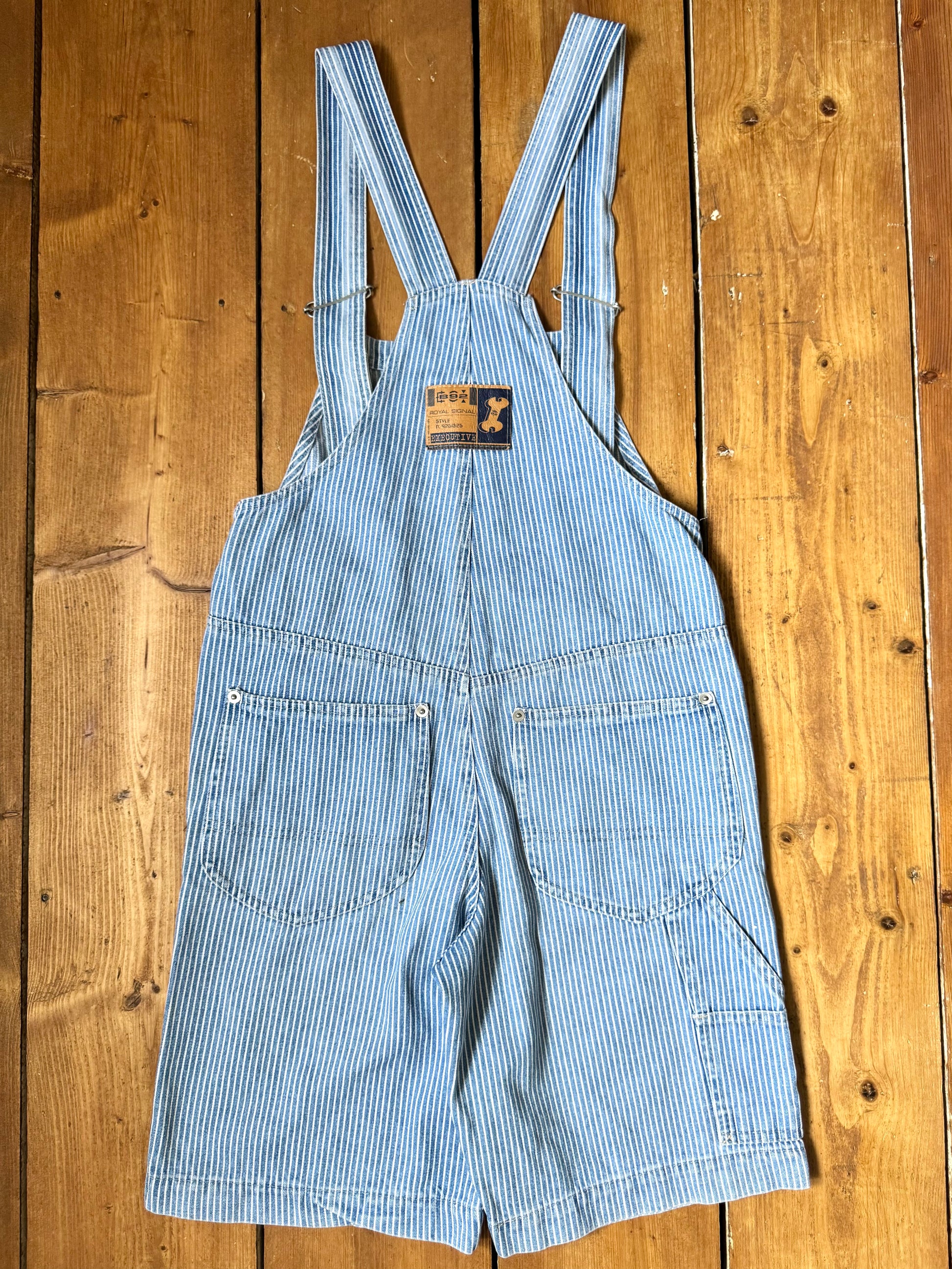 Vintage 90s hickory stripe denim short dungarees with adjustable straps. Vintage kids dungaree shorts. Handpicked for Bee Tiny kids vintage.