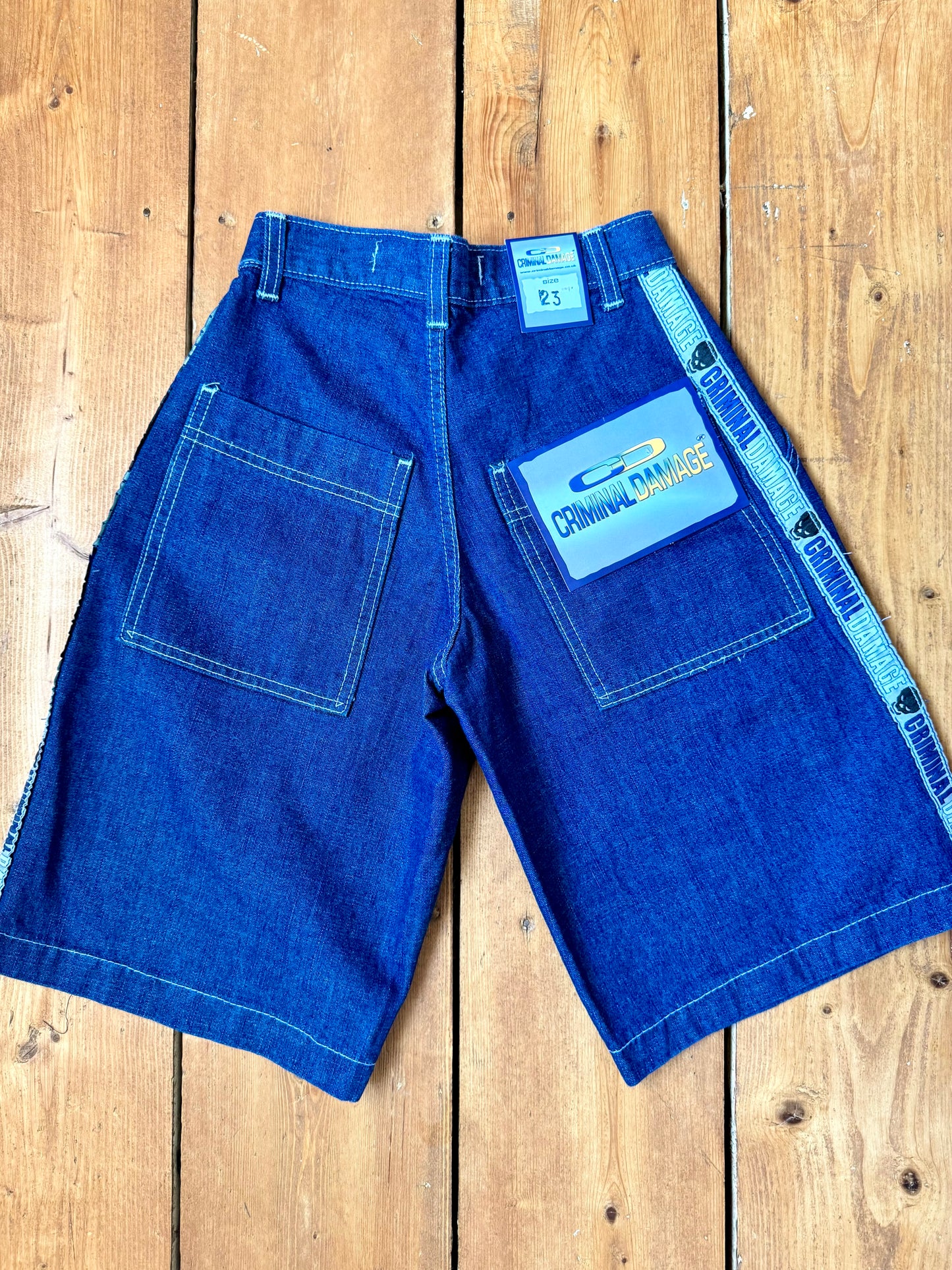 Vintage Y2K Criminal Damage deadstock denim shorts. Kids vintage jorts new with tags wasit 23". Handpicked for Bee Tiny kids vintage.