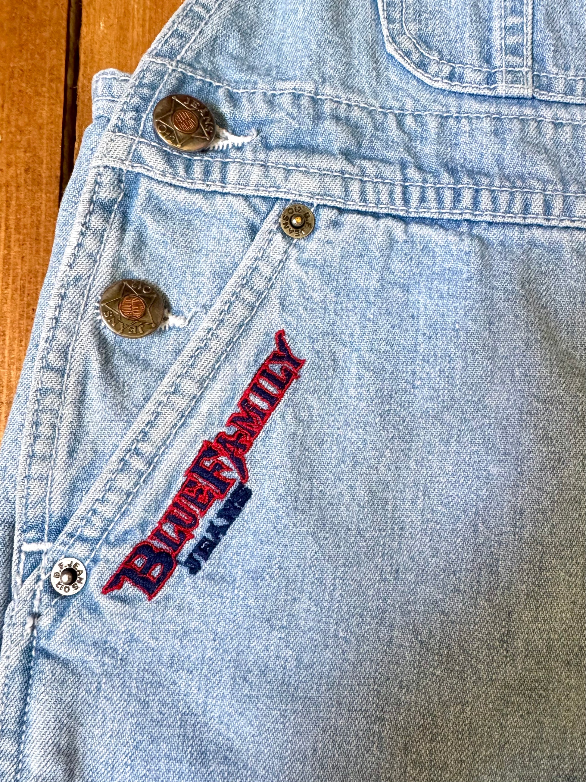 Authentic 90s Blue Family denim short dungarees with adjustable straps, embroidered branding and classic light wash denim. Perfect vintage summer style. Handpicked for Bee Tiny kids vintage. Vintage 90s shortalls.