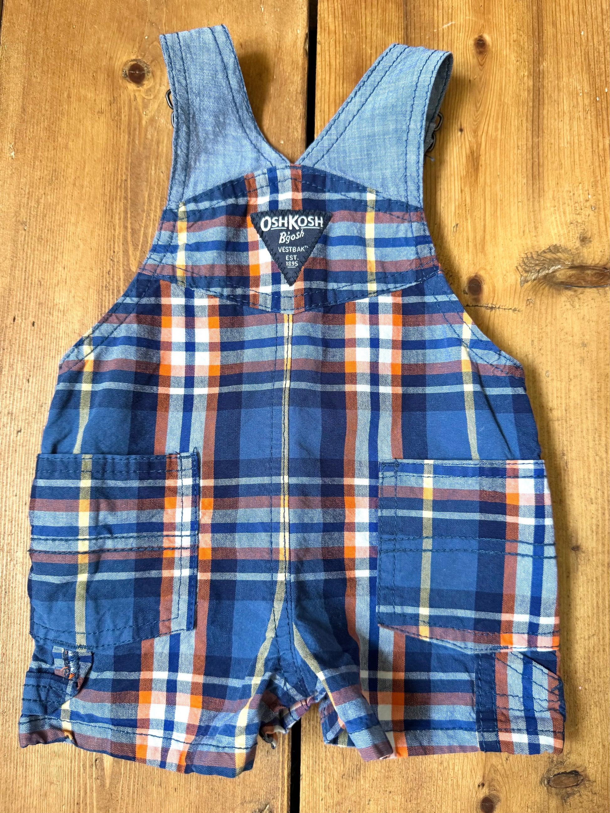 Vintage OshKosh checked dungaree shorts, in blue and orange check.Authentic early 2000s baby dungarees handpicked for Bee Tiny kids vintage.