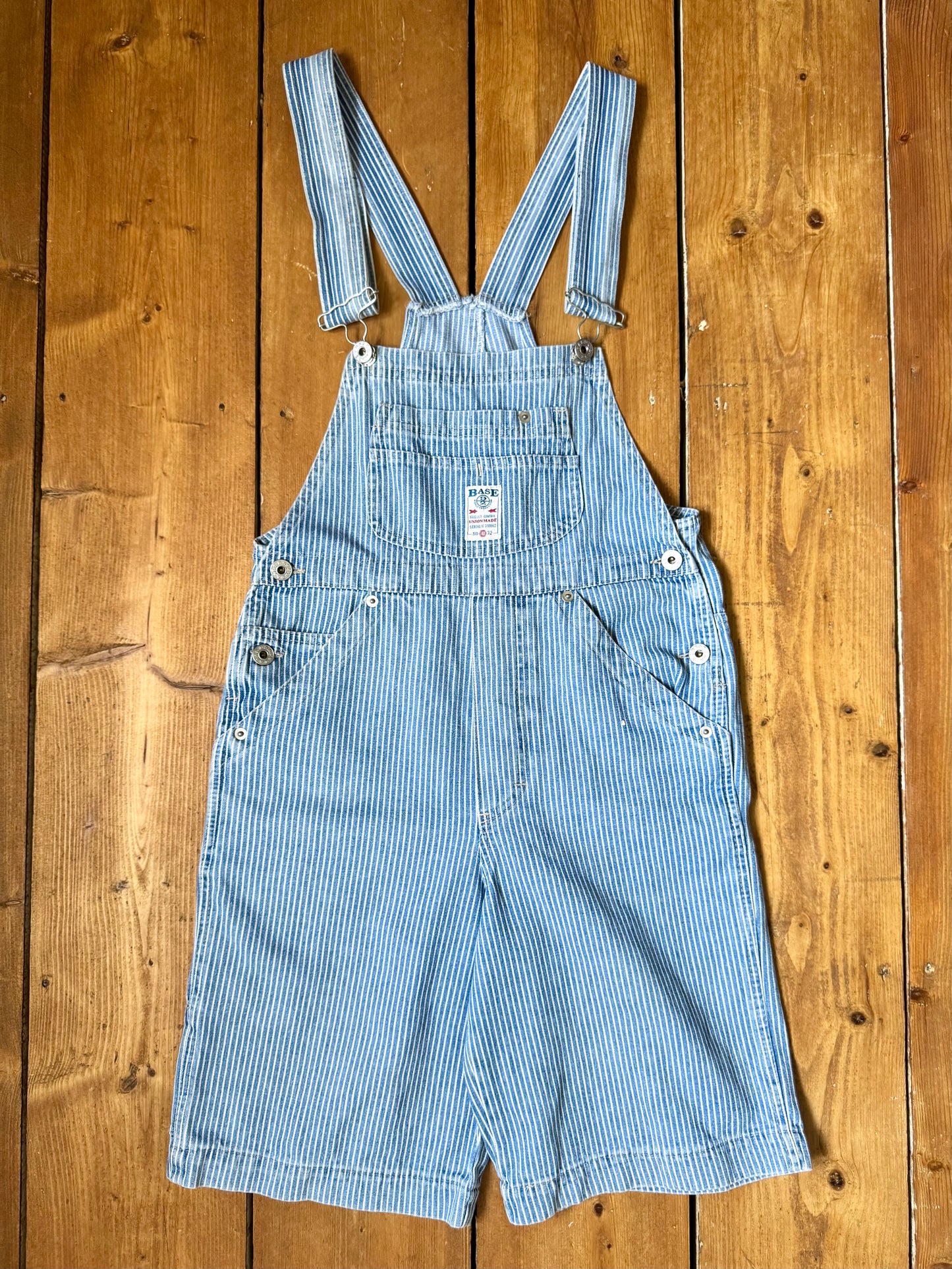 Vintage 90s hickory stripe denim short dungarees with adjustable straps. Vintage kids dungaree shorts. Handpicked for Bee Tiny kids vintage.