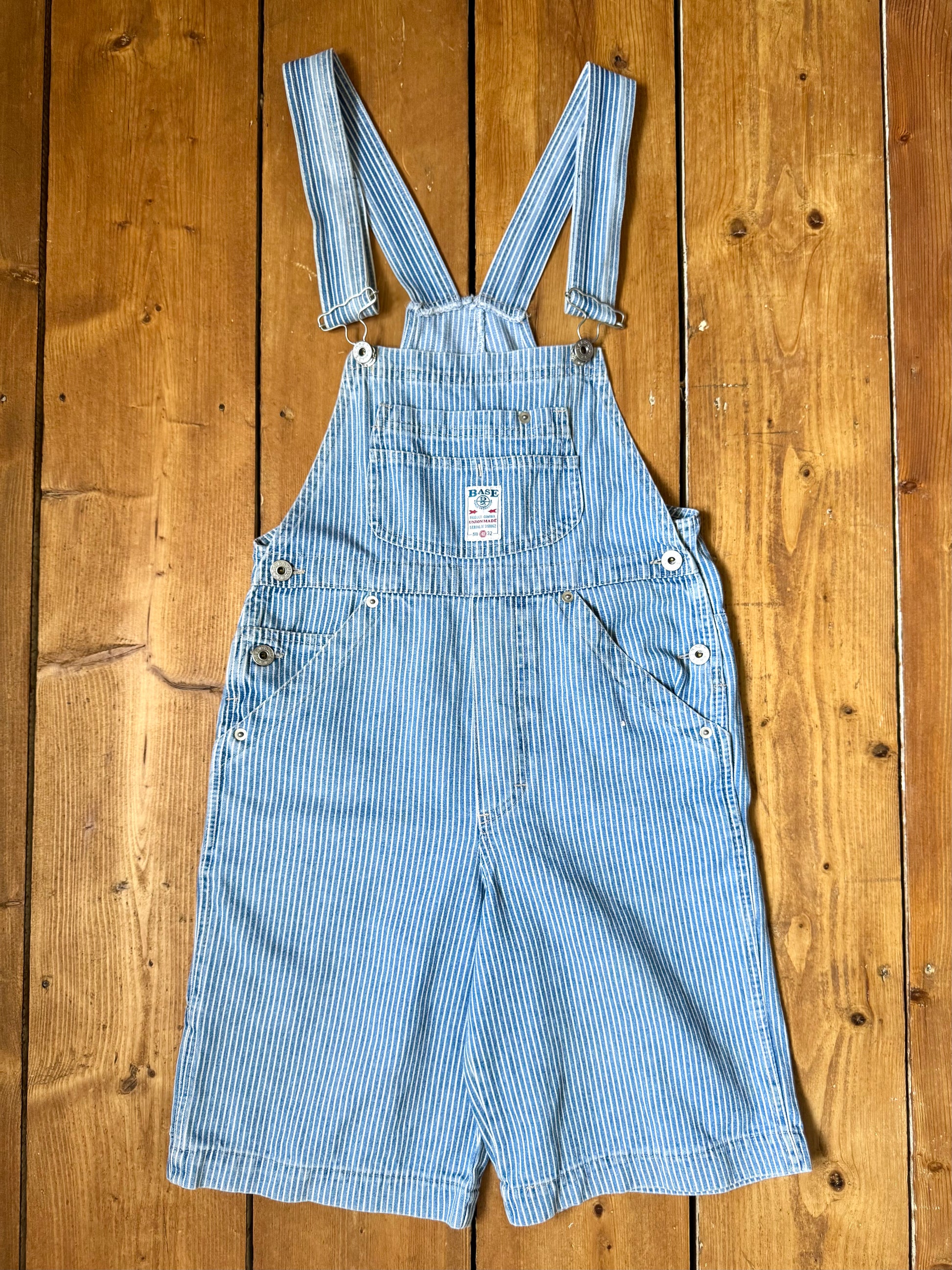 Vintage 90s hickory stripe denim short dungarees with adjustable straps. Vintage kids dungaree shorts. Handpicked for Bee Tiny kids vintage.