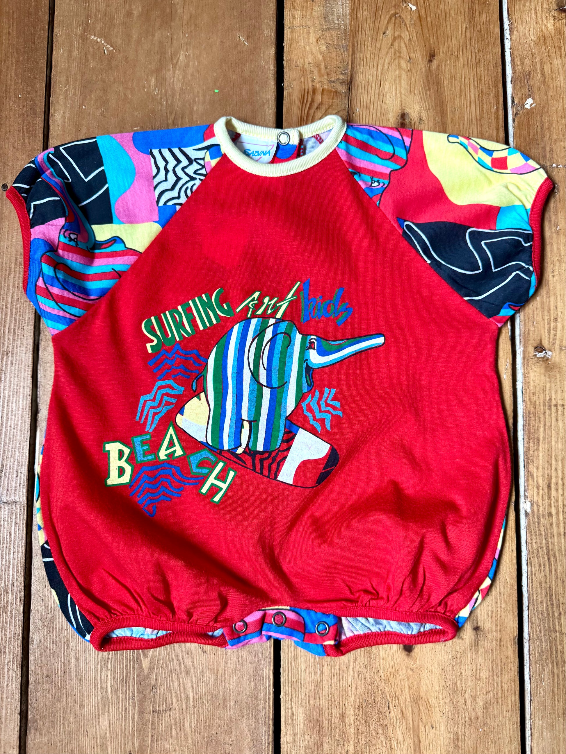 Vintage 90s colourful elephant baby romper with bold prints. Handpicked for Bee Tiny kids vintage.