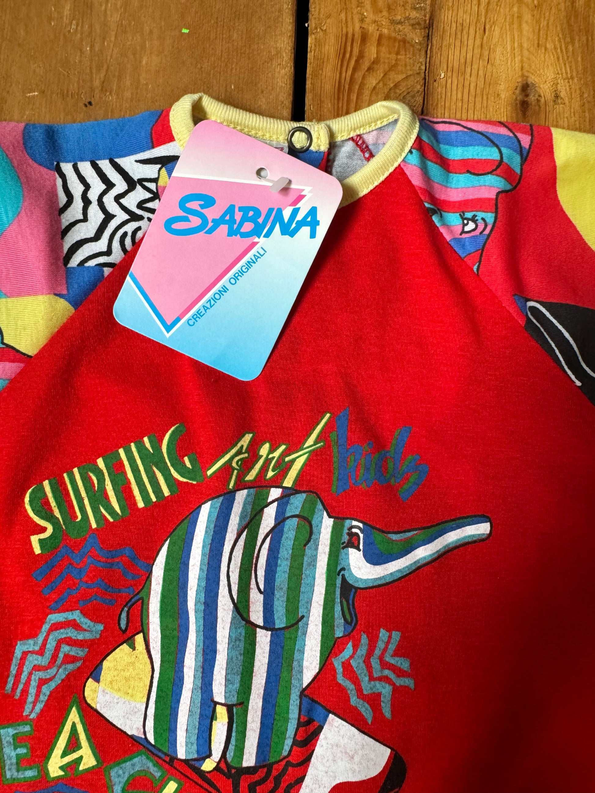 Vintage 90s colourful elephant baby romper with bold prints. Handpicked for Bee Tiny kids vintage.