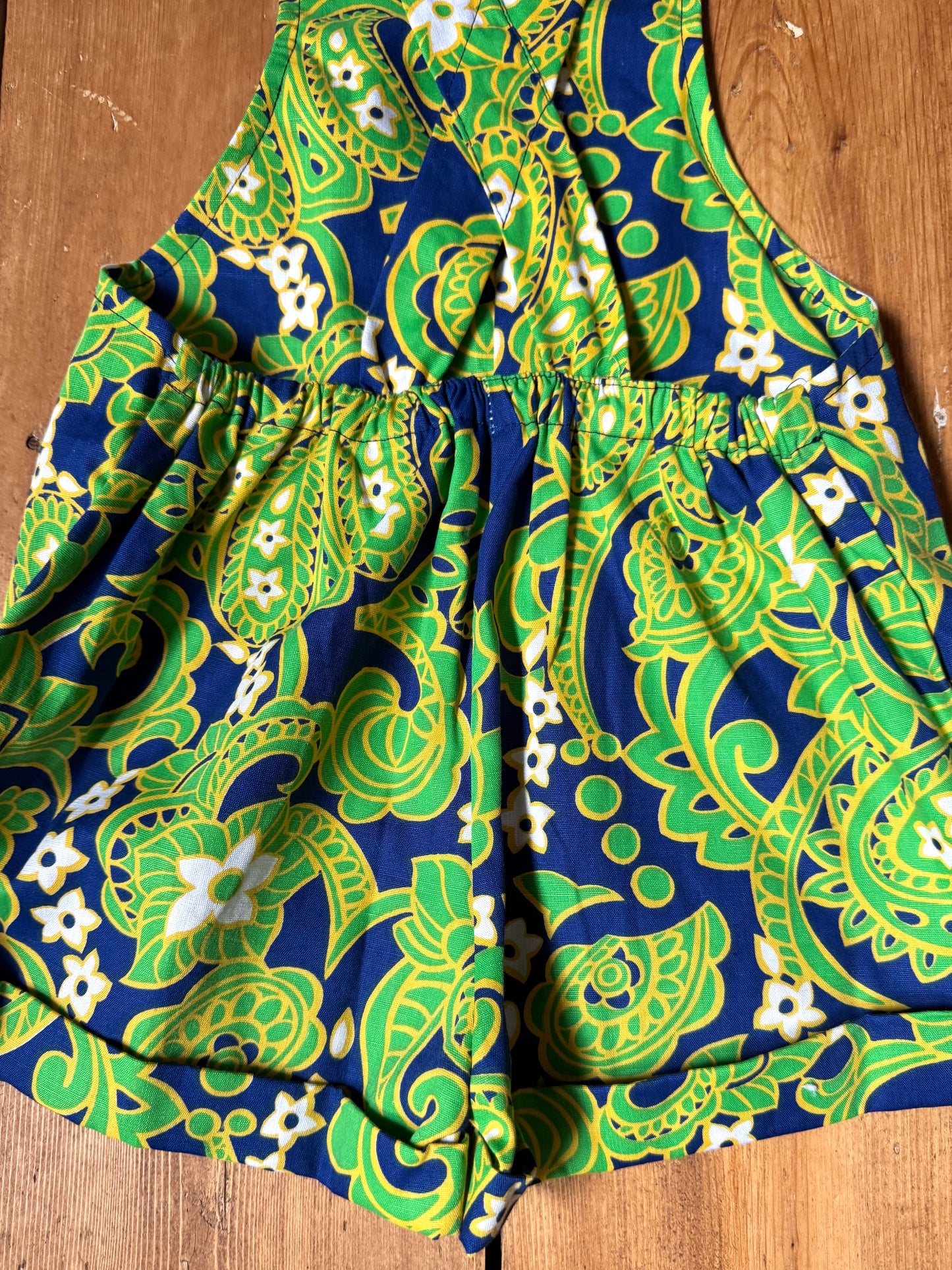 Vintage 70s green romper, dungaree shorts. Psychedelic print dungaree shorts. Handpicked for Bee Tiny kids vintage. 