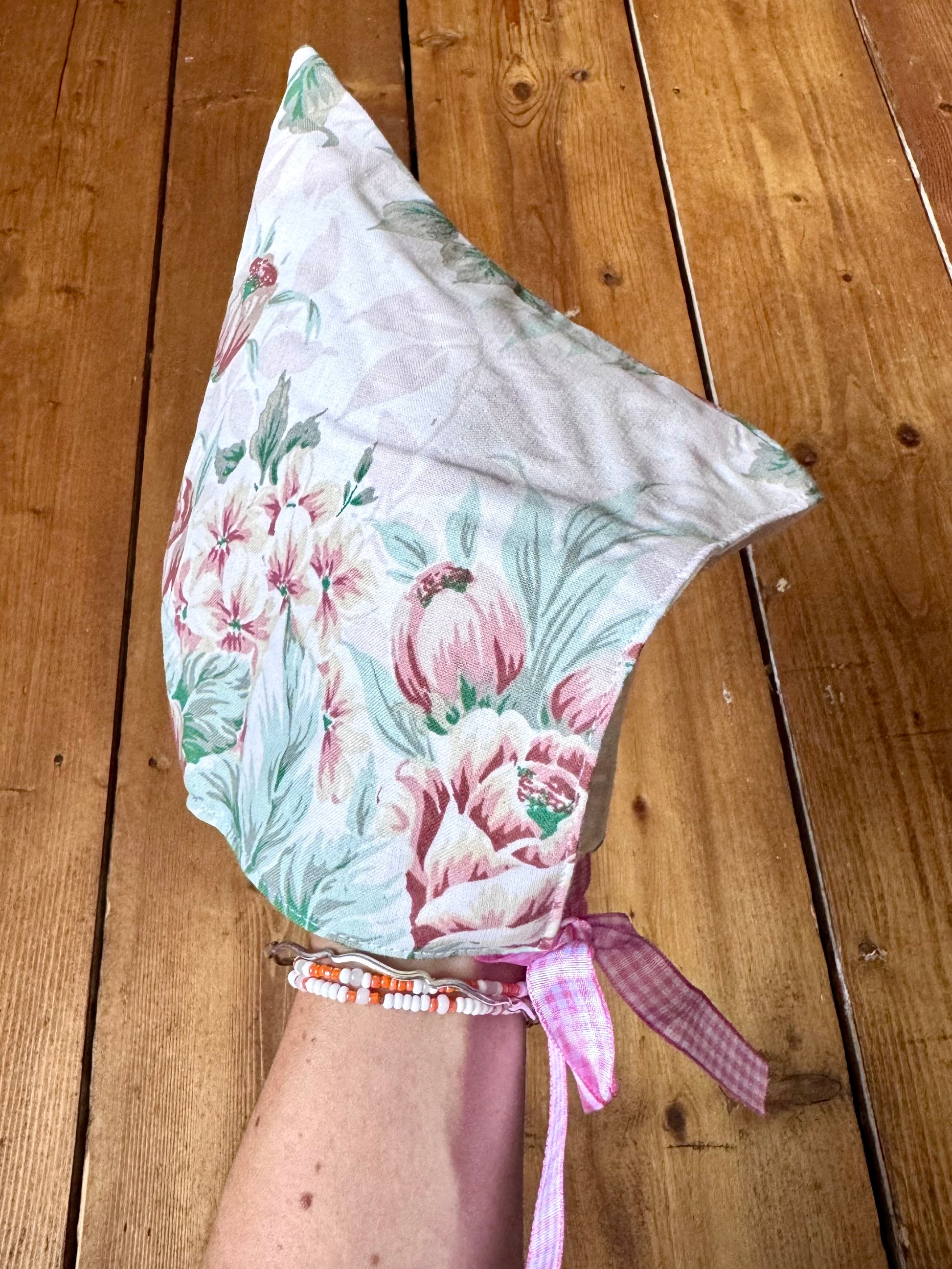 Handmade vintage floral children's set featuring wide-leg trousers and a matching pixie bonnet. One-of-a-kind, sustainably made from rescued fabric. Handmade for Bee Tiny kids vintage.