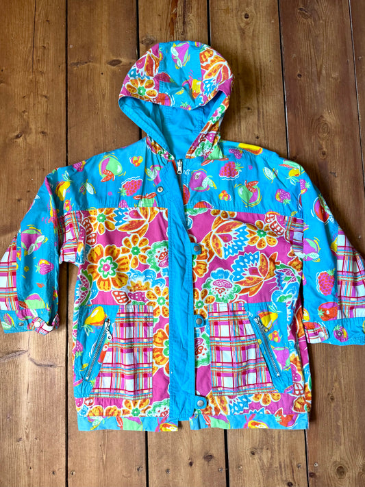 Vintage 90s reversible kids hooded jacket featuring colourful tropical floral prints and a turquoise reverse. Kids vintage lightweight summer coat. Handpicked for Bee Tiny kids vintage.
