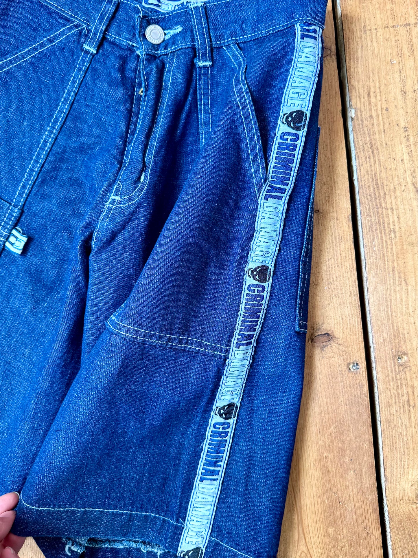 Vintage Y2K Criminal Damage deadstock denim shorts. Kids vintage jorts new with tags wasit 23". Handpicked for Bee Tiny kids vintage.