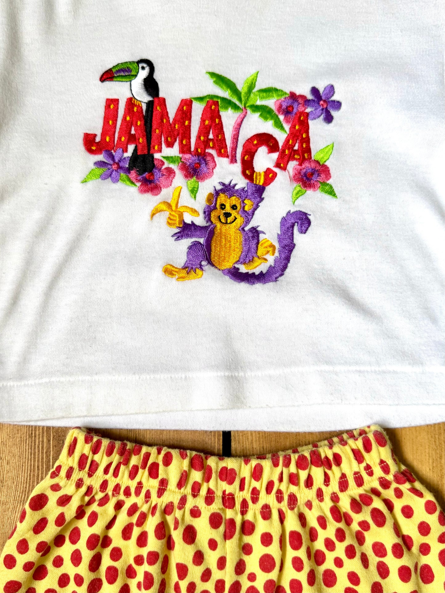 Vintage 90s embroidered Jamaica tee with yellow polka dot shorts. Authentic late 80s/early 90s children's vintage, handpicked for Bee Tiny kids vintage.