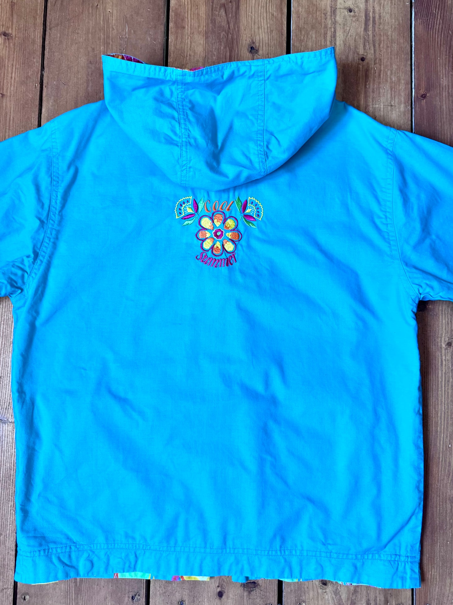 Vintage 90s reversible kids hooded jacket featuring colourful tropical floral prints and a turquoise reverse. Kids vintage lightweight summer coat. Handpicked for Bee Tiny kids vintage.