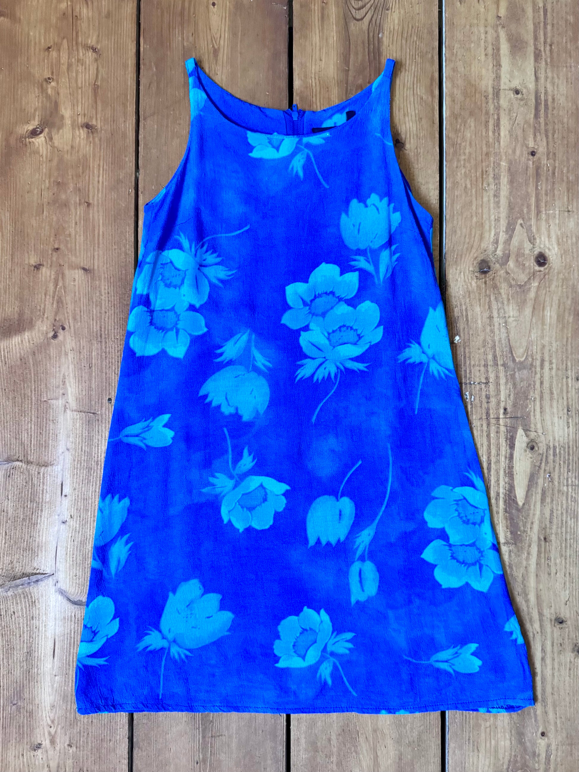 Vintage 90s Debenhams blue floral shift dress for kids. Made in the U.K. from 100% viscose with a timeless A-line silhouette. Handpicked for Bee Tiny kids vintage.