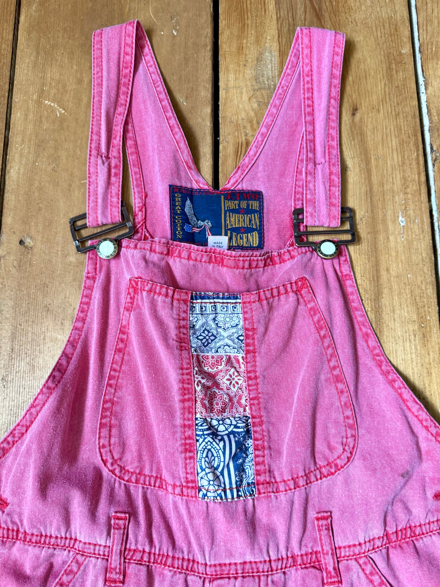 Vintage 90s pink dungaree shorts with paisley patchwork detailing. A colourful summer vintage favourite for kids. Handpicked for Bee Tiny kids vintage. 