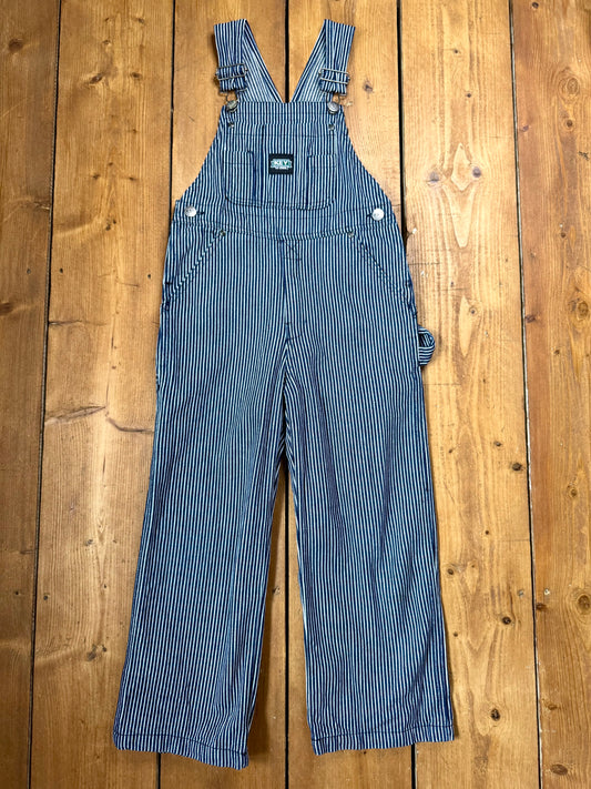 Vintage Key kids hickory stripe dungarees, adjustable straps, utility pockets, and authentic workwear styling. A timeless American heritage piece. Handpicked for Bee Tiny kids vintage.