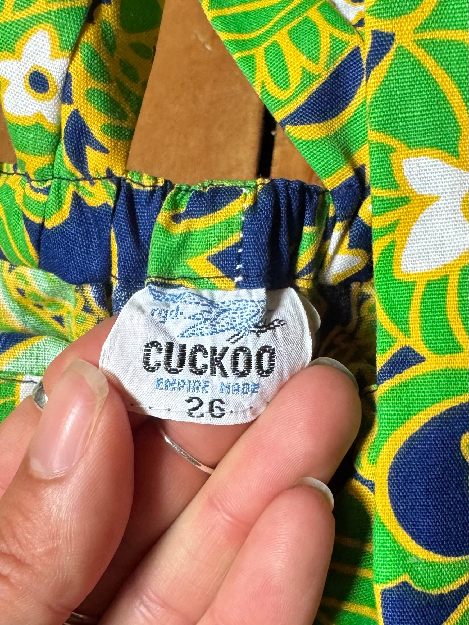 Vintage 70s green romper, dungaree shorts. Psychedelic print dungaree shorts. Handpicked for Bee Tiny kids vintage. 