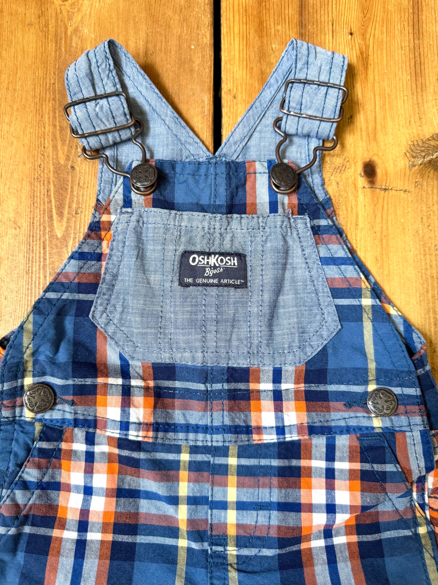 Vintage OshKosh checked dungaree shorts, in blue and orange check.Authentic early 2000s baby dungarees handpicked for Bee Tiny kids vintage.