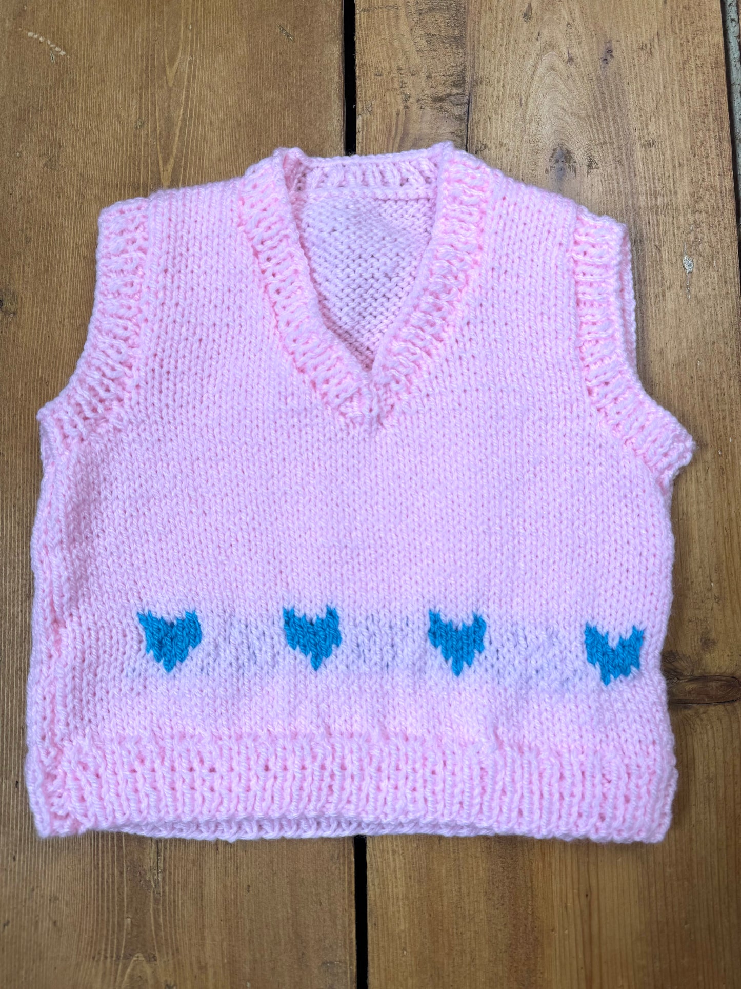 Handknitted pink kids sweater vest with a heart design. Age 1 year. Handpicked for Bee Tiny kids vintage. 