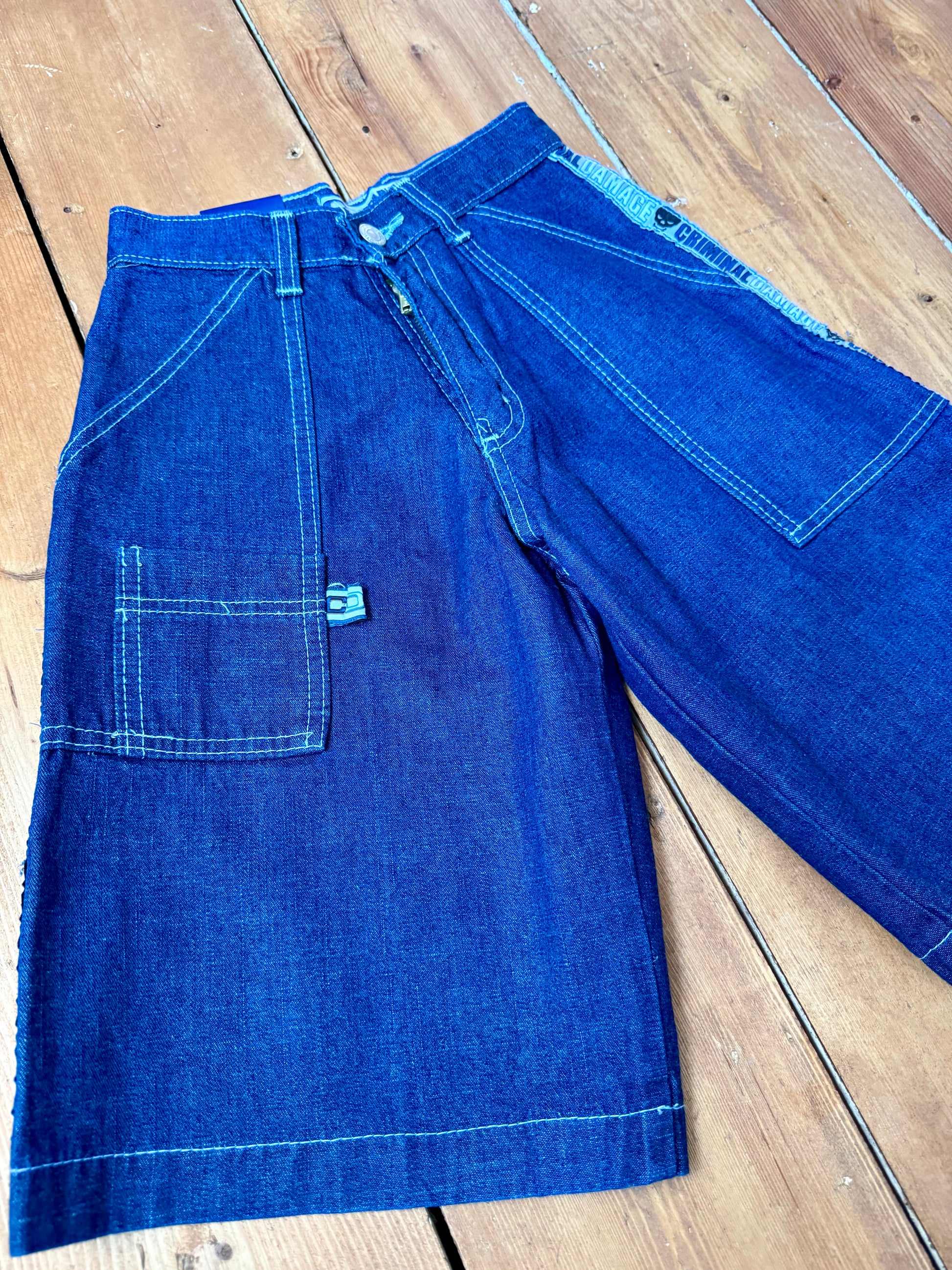 Vintage Y2K Criminal Damage deadstock denim shorts. Kids vintage jorts new with tags wasit 23". Handpicked for Bee Tiny kids vintage.