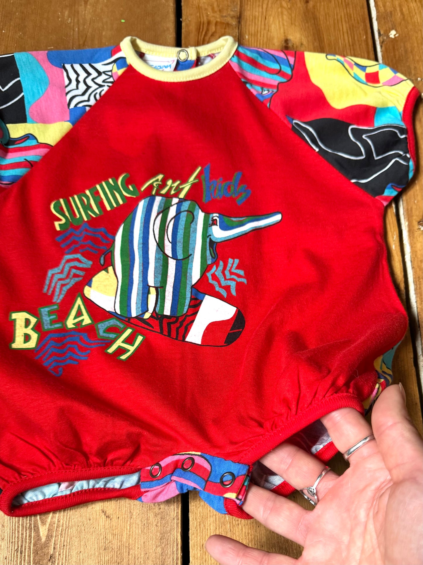 Vintage 90s colourful elephant baby romper with bold prints. Handpicked for Bee Tiny kids vintage.