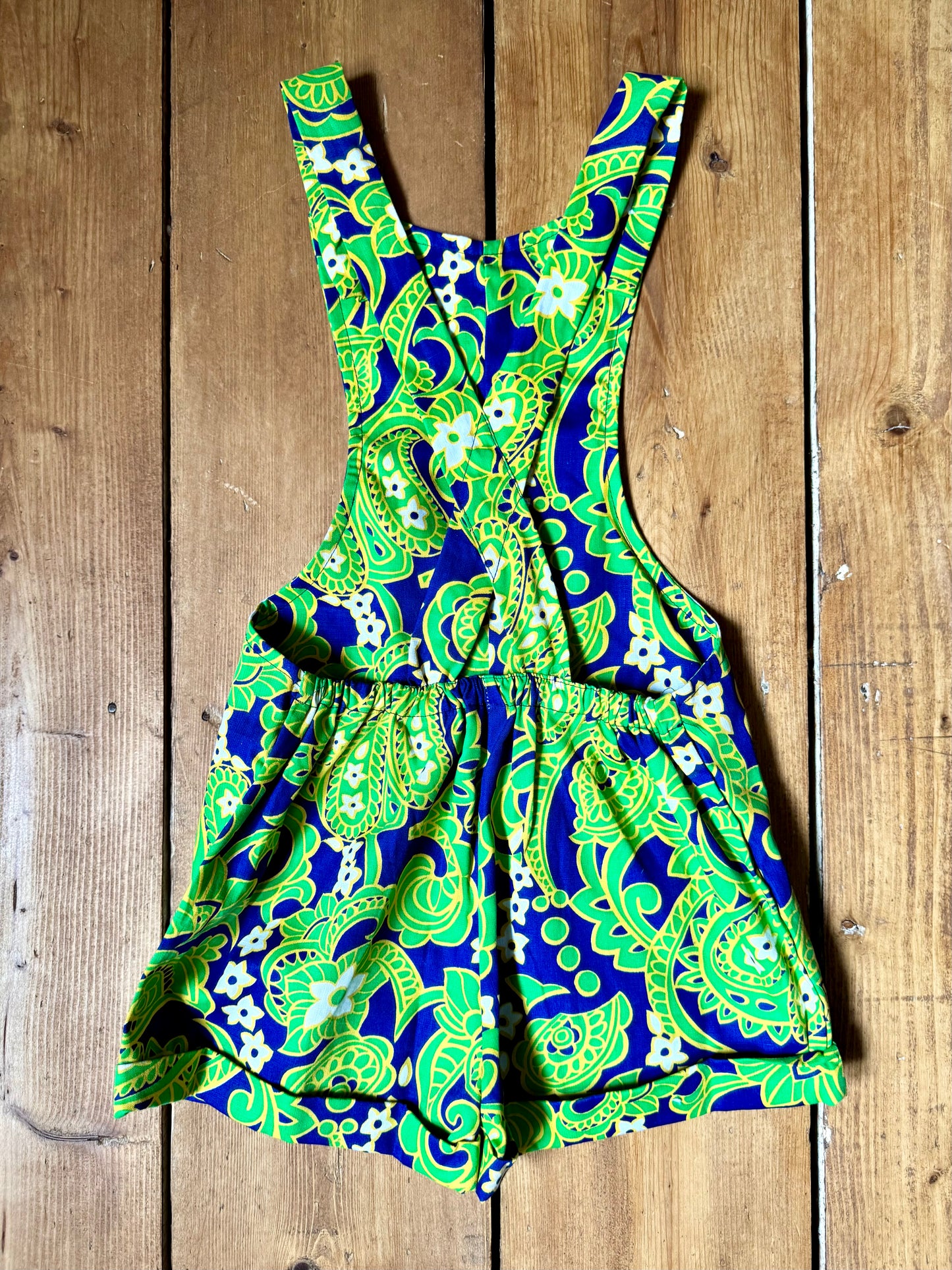 Vintage 70s green romper, dungaree shorts. Psychedelic print dungaree shorts. Handpicked for Bee Tiny kids vintage. 