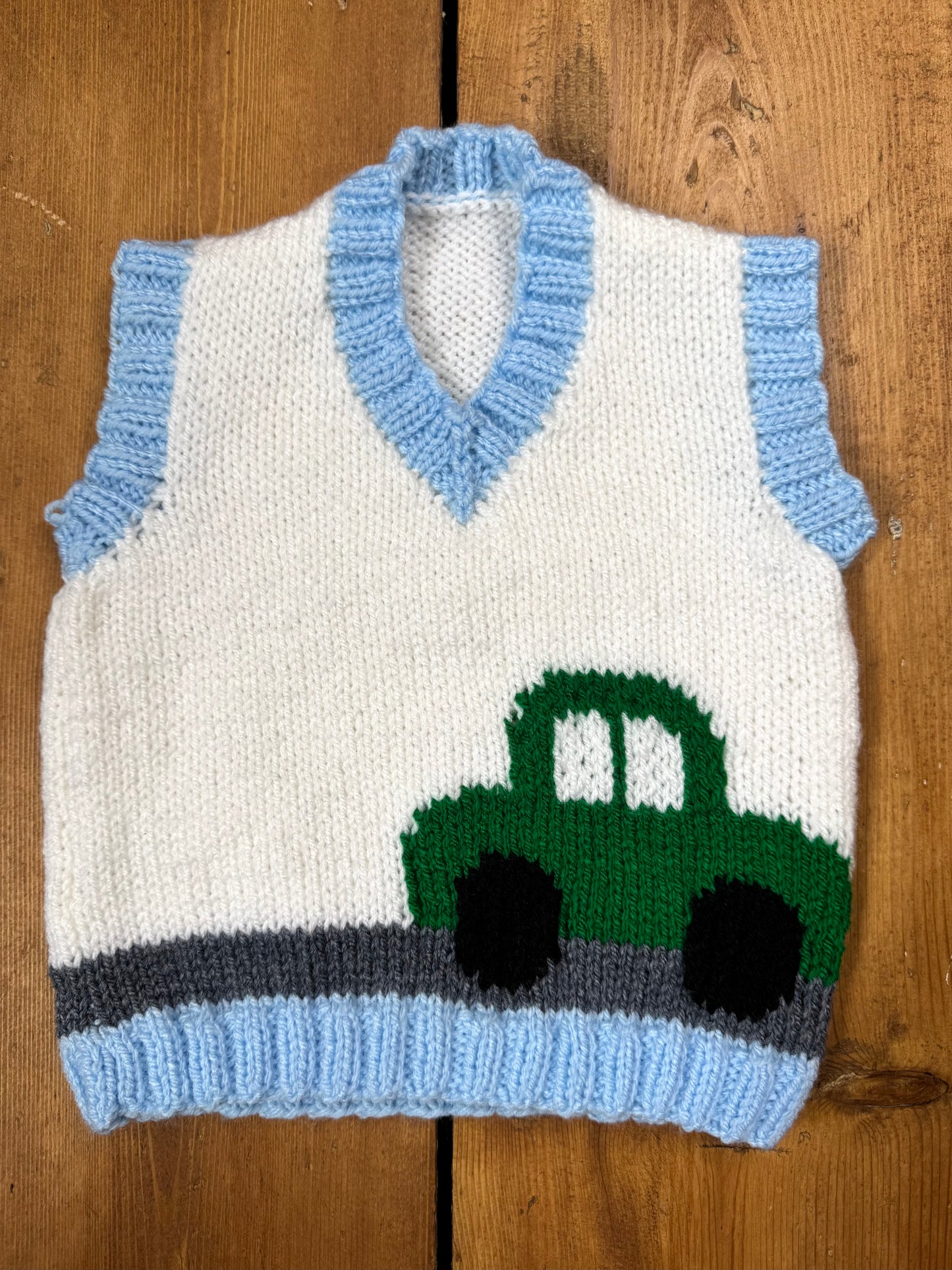 Handknitted vintage style kids sweater vest with car detail. Handpicked for Bee Tiny.