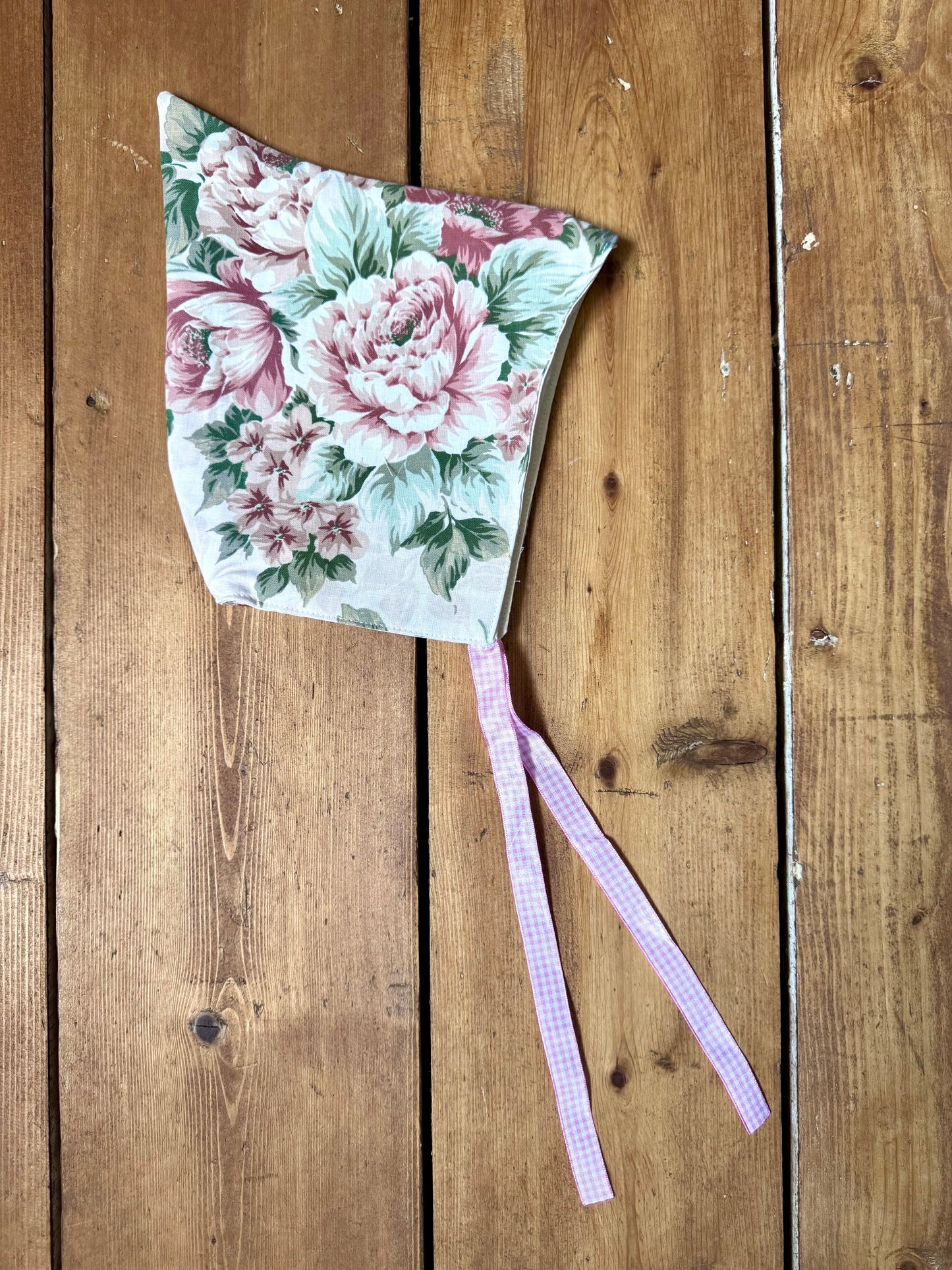 Handmade vintage floral children's set featuring wide-leg trousers and a matching pixie bonnet. One-of-a-kind, sustainably made from rescued fabric. Handmade for Bee Tiny kids vintage.