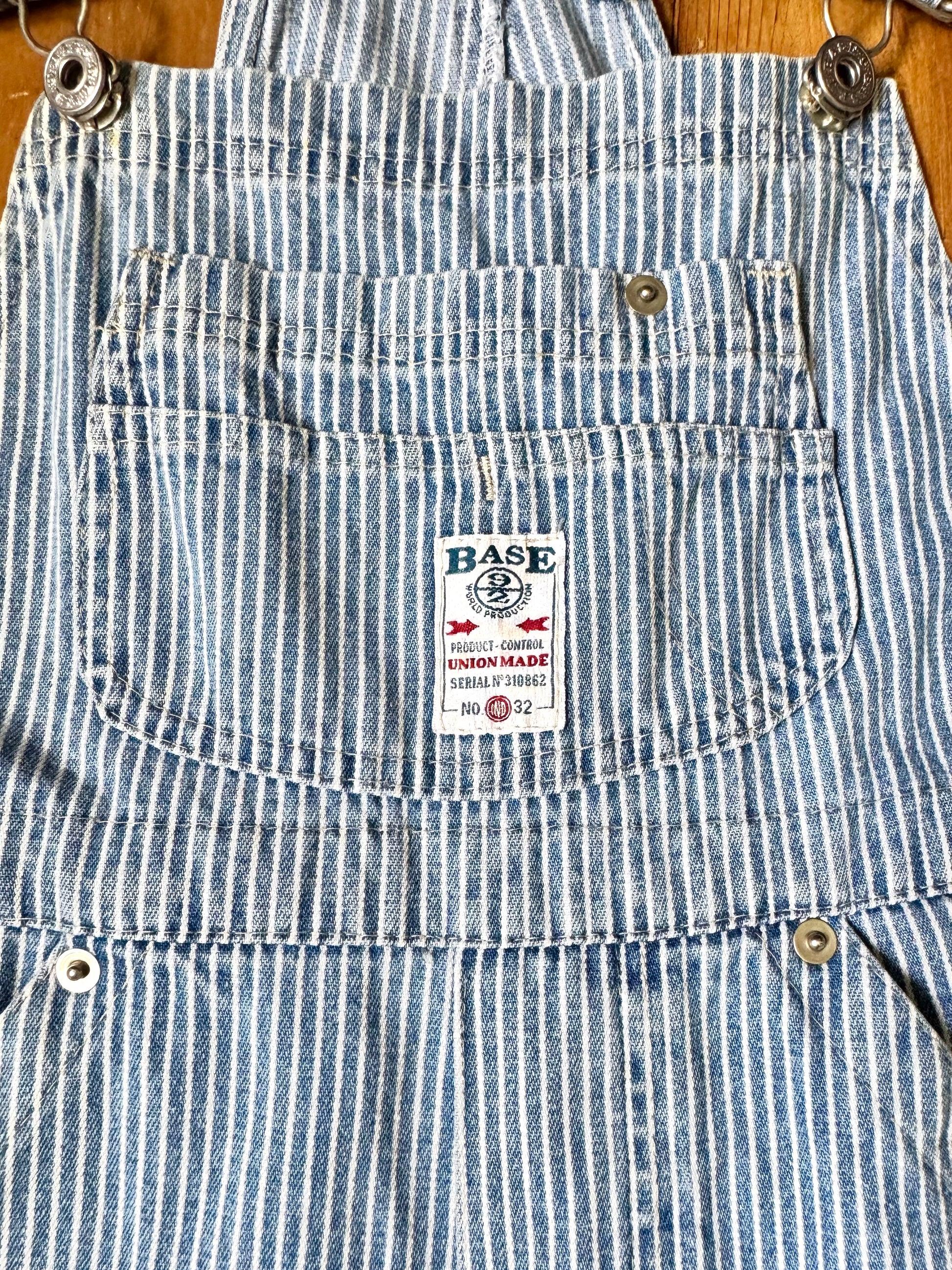 Vintage 90s hickory stripe denim short dungarees with adjustable straps. Vintage kids dungaree shorts. Handpicked for Bee Tiny kids vintage.