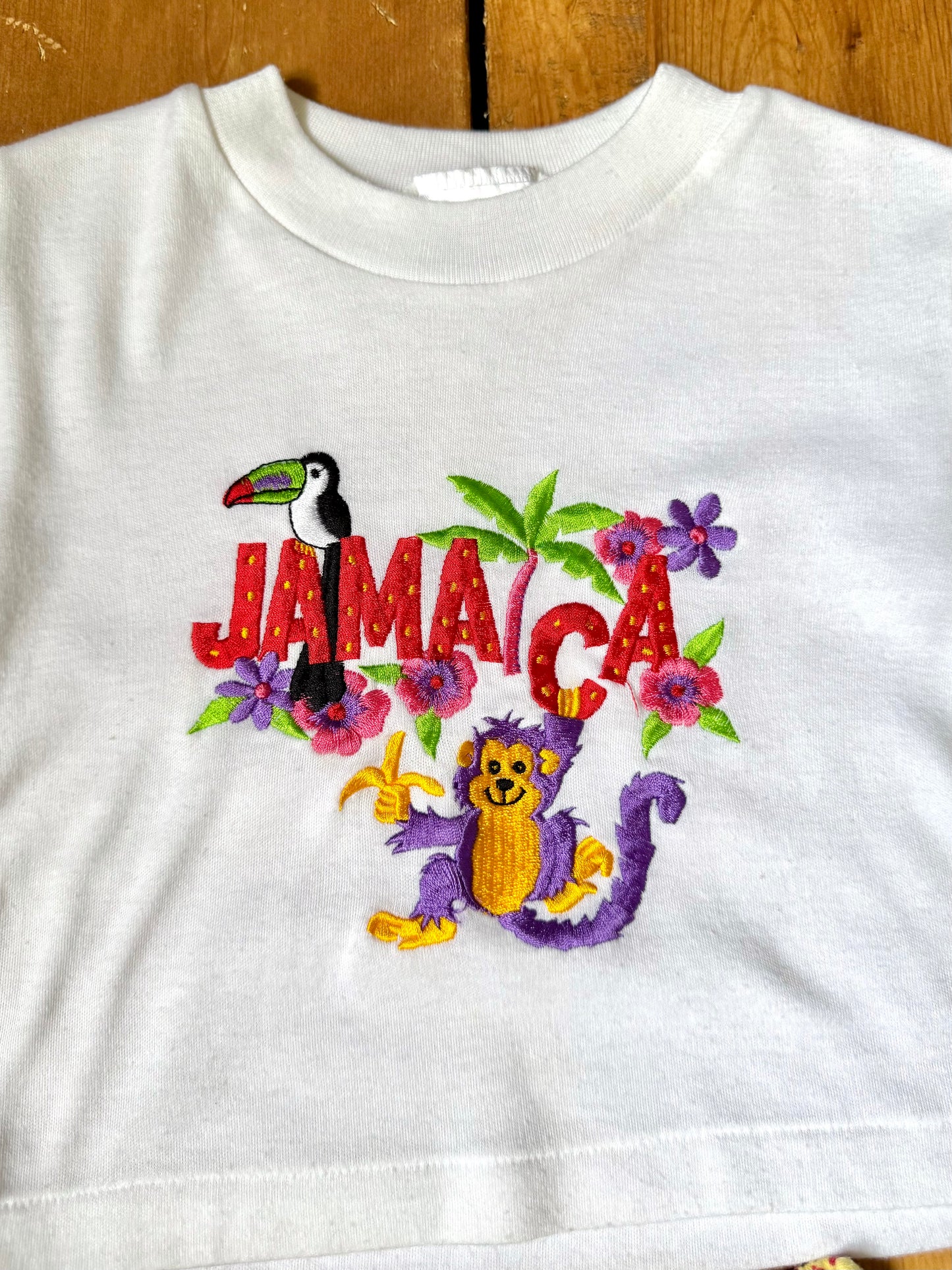 Vintage 90s embroidered Jamaica tee with yellow polka dot shorts. Authentic late 80s/early 90s children's vintage, handpicked for Bee Tiny kids vintage.