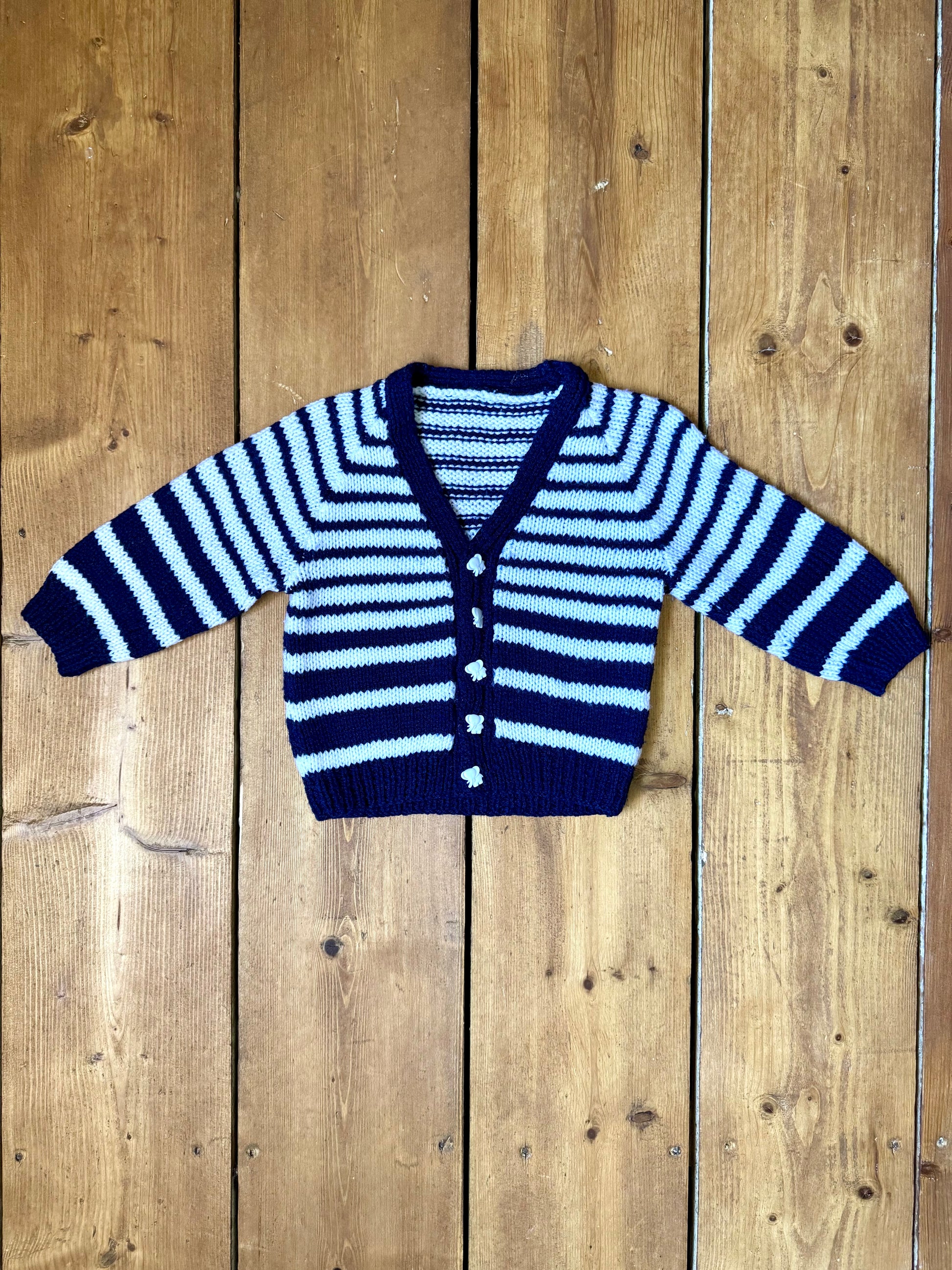 Vintage handknitted kids blue and white striped cardigan with elephant buttons. Age 1 year. Handpicked for Bee Tiny kids vintage.