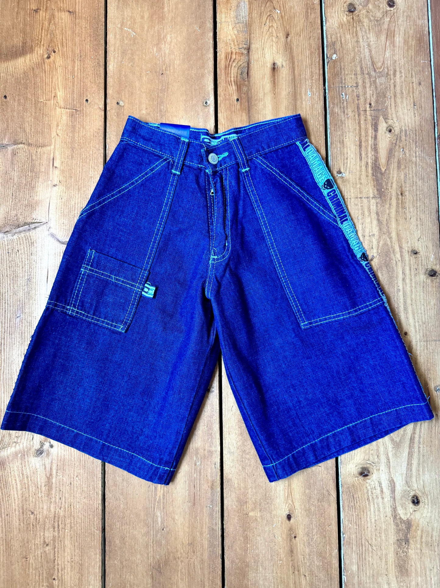 Vintage Y2K Criminal Damage deadstock denim shorts. Kids vintage jorts new with tags wasit 23". Handpicked for Bee Tiny kids vintage.