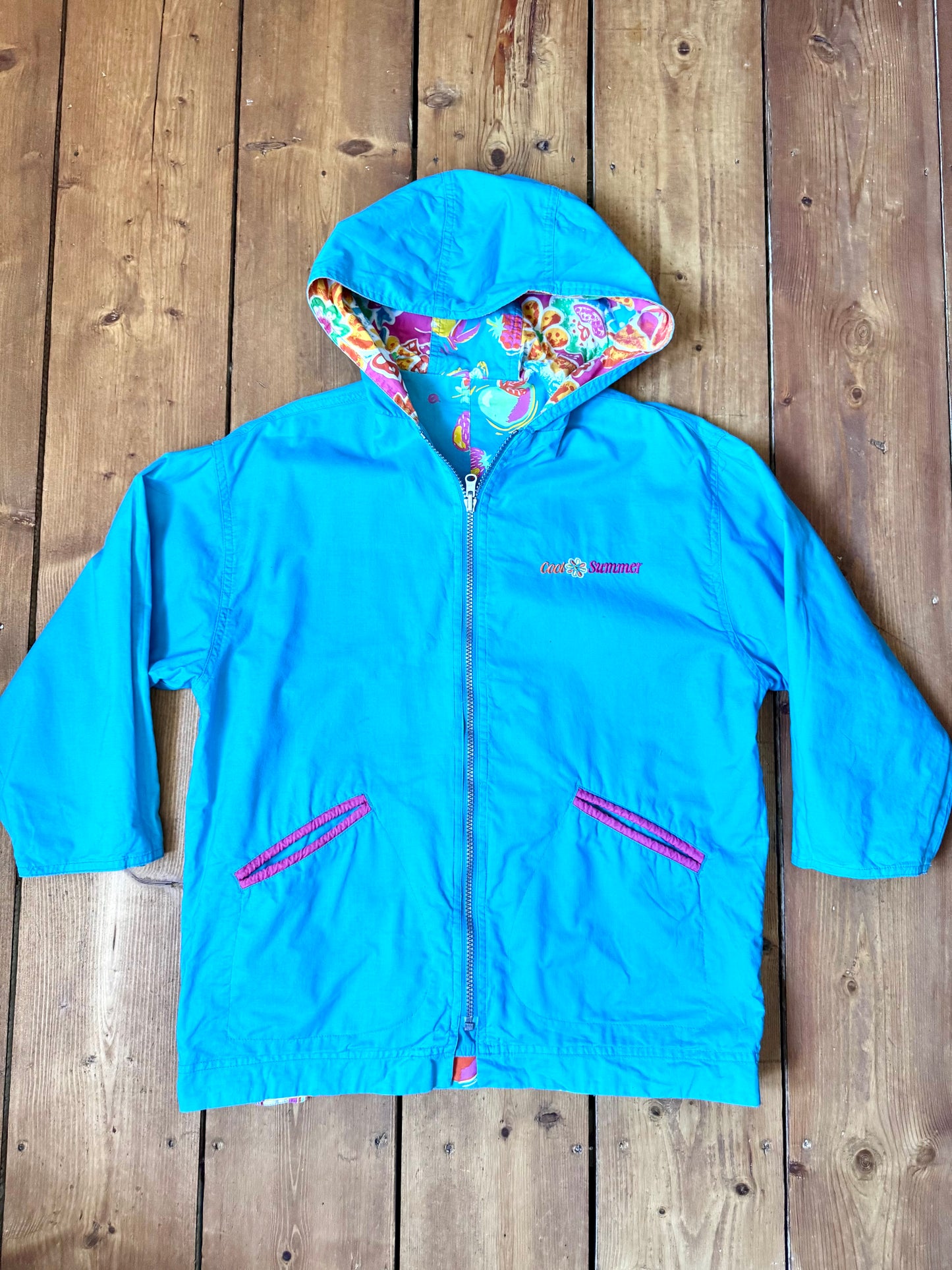 Vintage 90s reversible kids hooded jacket featuring colourful tropical floral prints and a turquoise reverse. Kids vintage lightweight summer coat. Handpicked for Bee Tiny kids vintage.