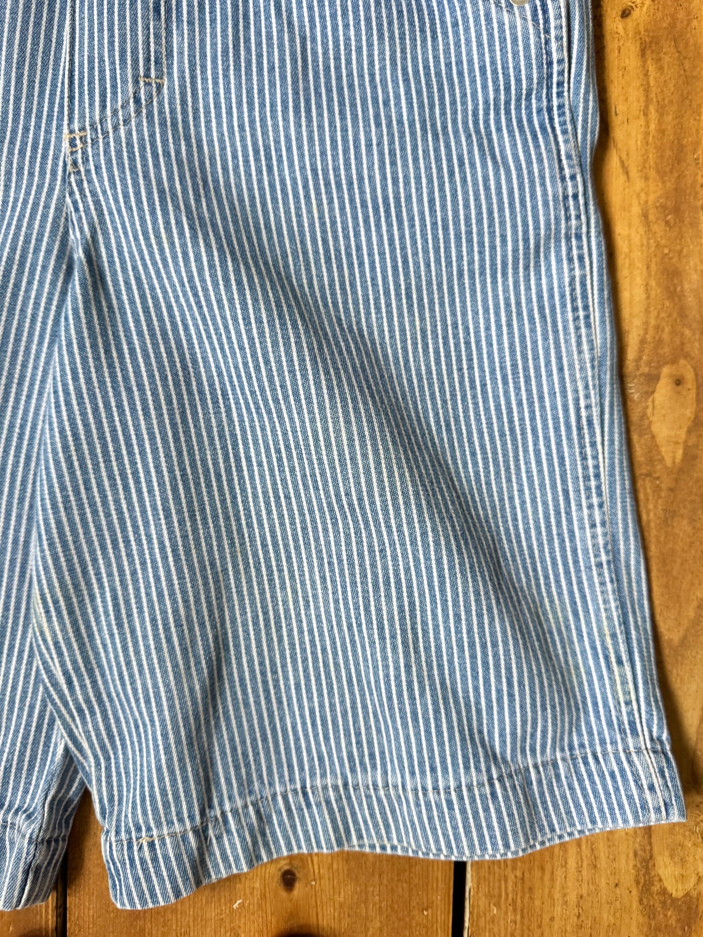 Vintage 90s hickory stripe denim short dungarees with adjustable straps. Vintage kids dungaree shorts. Handpicked for Bee Tiny kids vintage.
